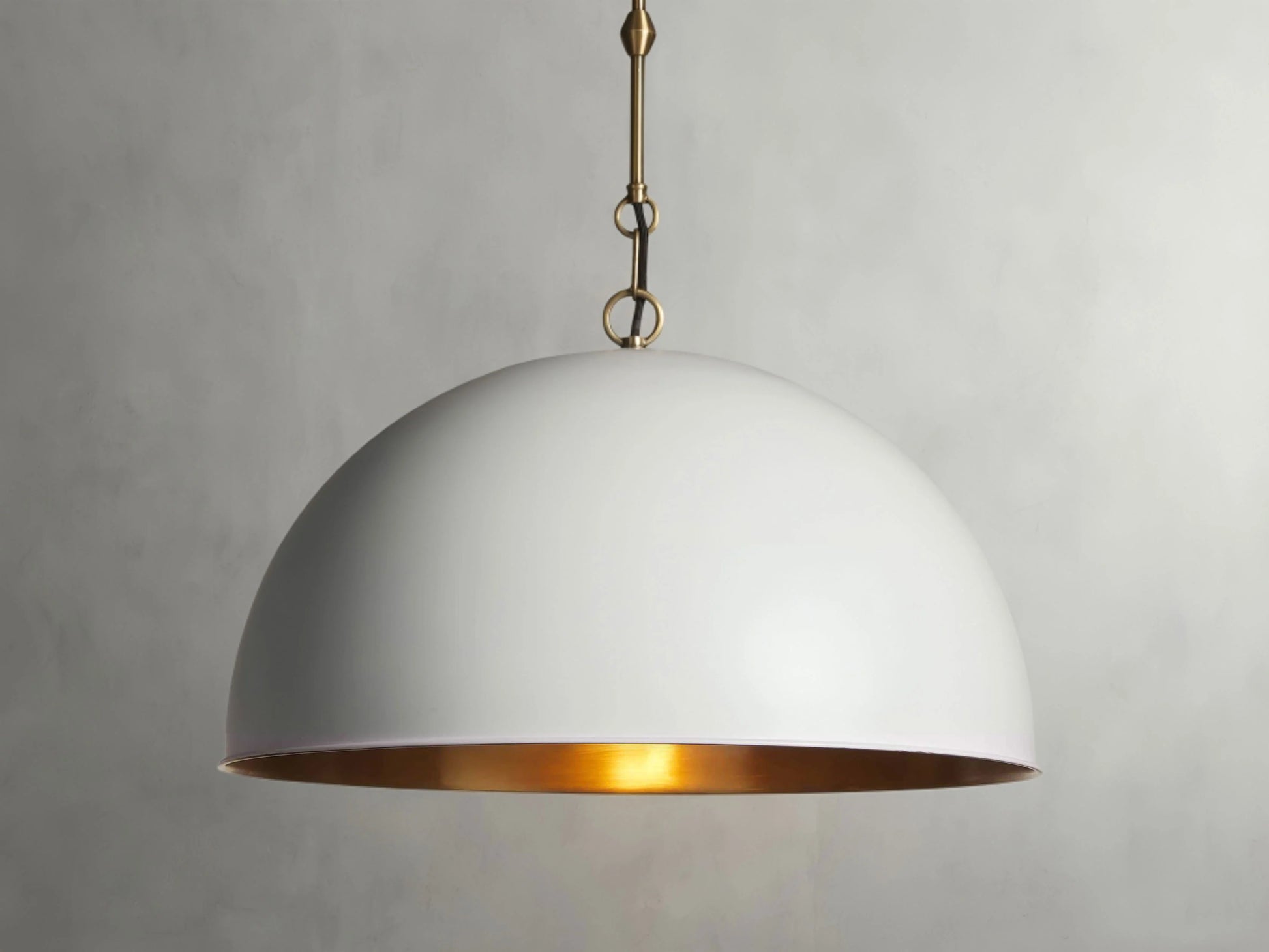 A white dome pendant light hanged from the ceiling that serves for dining room and kitchen island. 